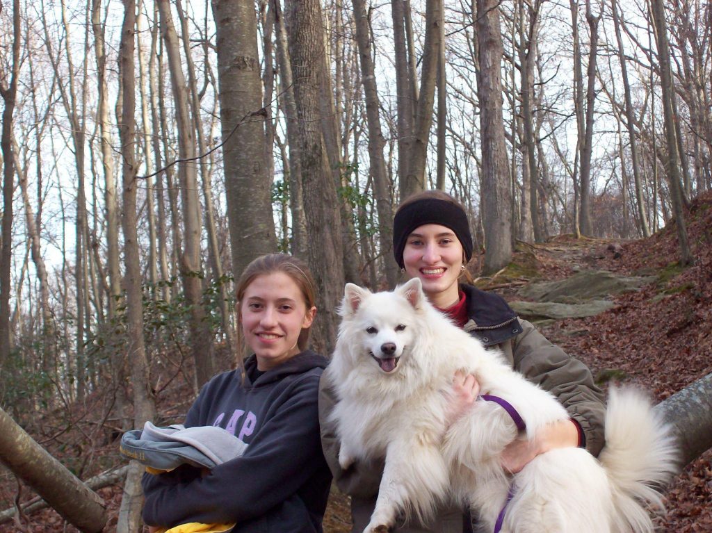 Myself holding pearl out on a hike